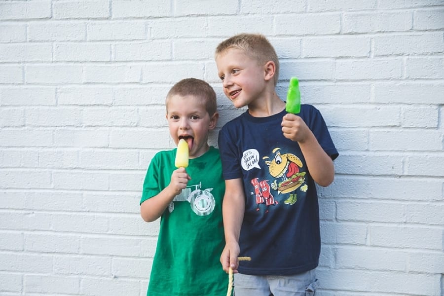 brothers eating popsicles