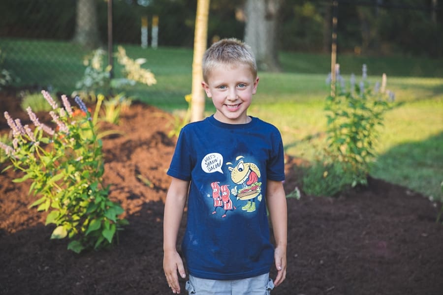 boy smiling in garden of pittsburgh home