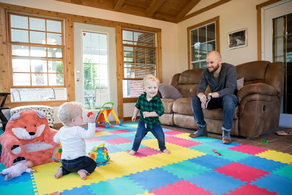 toddler boy dancing in living room Family Photos at home in Bridgeville