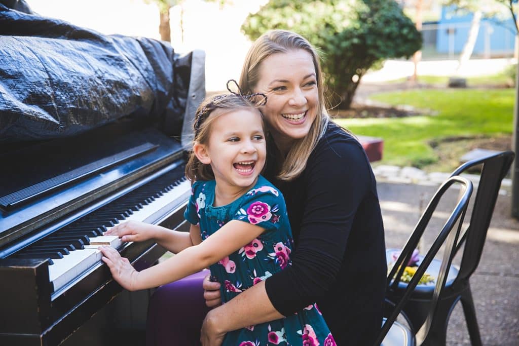 adventures and family photos with this mother and daughter playing outdoor piano at carnegie mellon campus pittsburgh