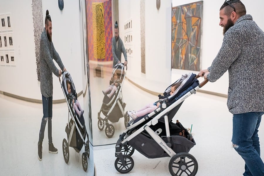 little girl in stroller with mom at carnegie museum of art pittsburgh