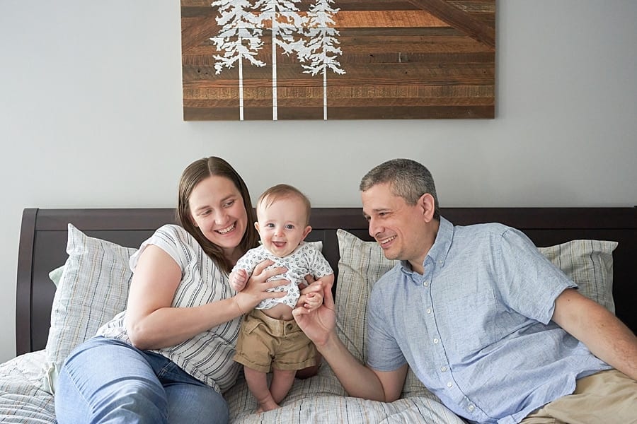 mom dad and baby in pine township bedroom Pine Township Family Photographer