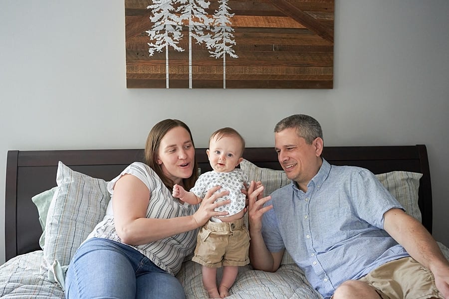 mom dad and baby in pine township bedroom Pine Township Family Photographer