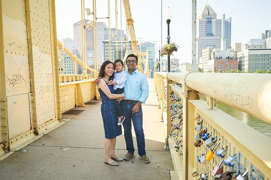 family posing on Clemente bridge pittsburgh for photo session