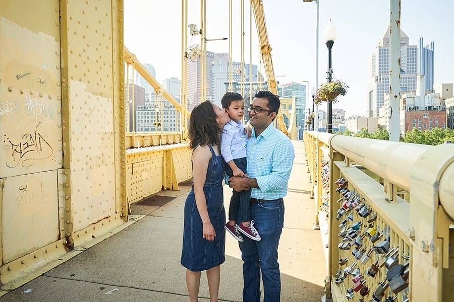 family posing on Clemente bridge pittsburgh for photo session