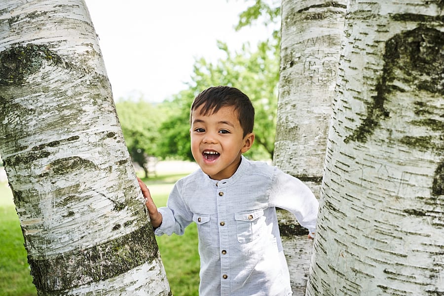 little boy in birch tree at Mellon park