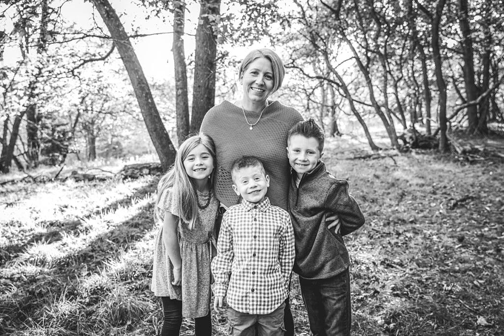 mom and her three kids for a fall family photo session