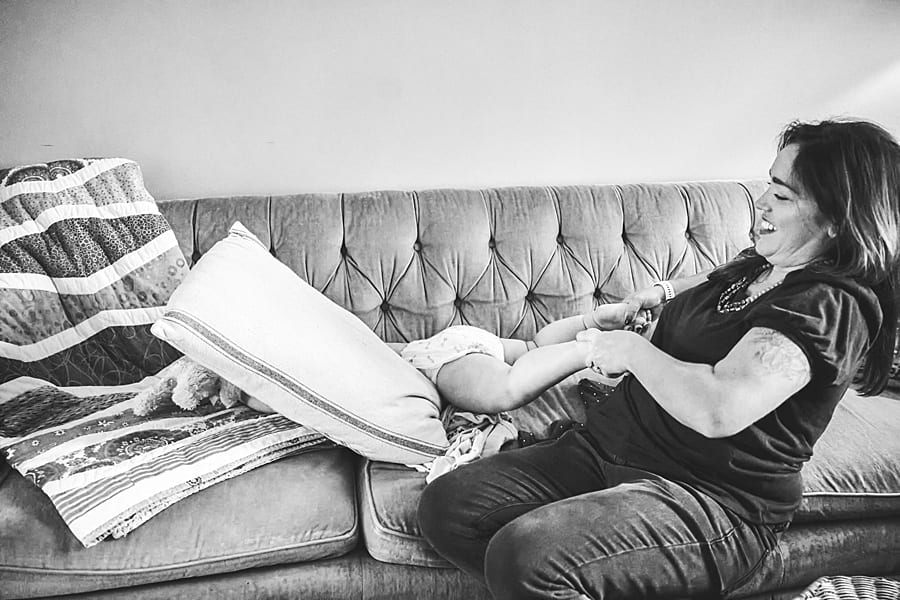little girl and mom in living room staying home is not your ordinary family photo session