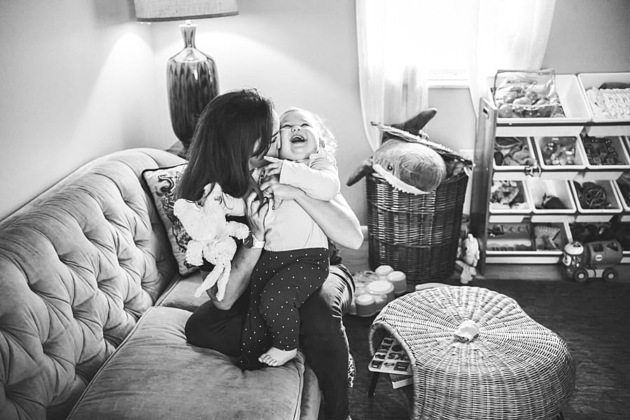 baby girl and mom in living room staying home is not your ordinary family photo session