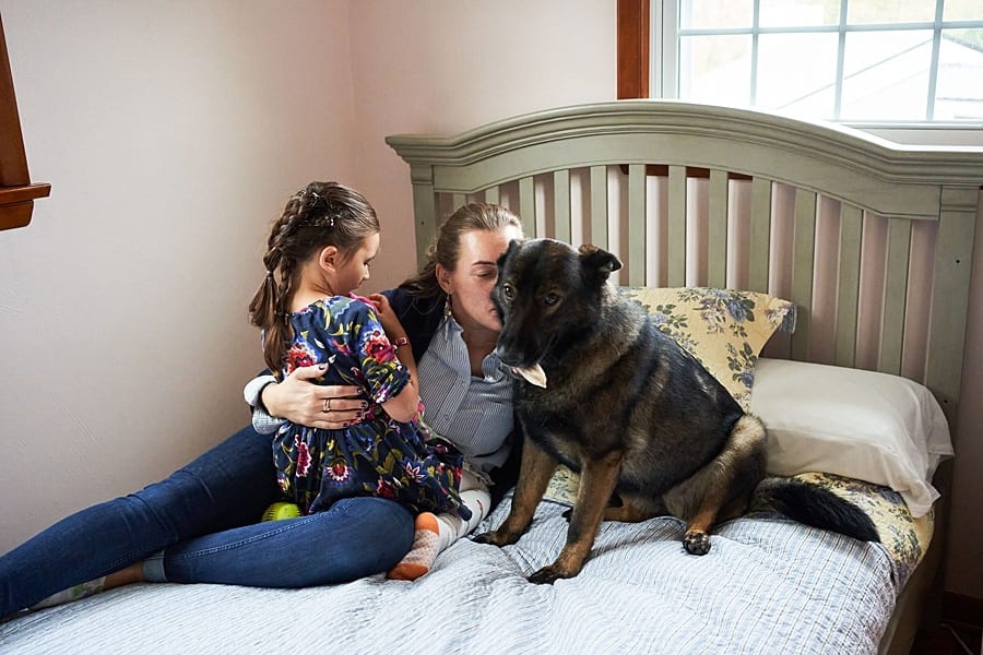 Mother and Daughter on bed for  Photo Session at their new Pittsburgh home and backyard