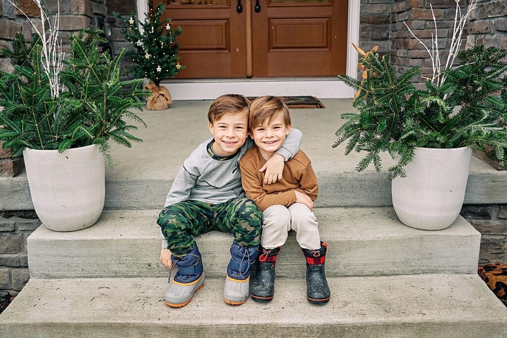 Mom dad and boys on porch for Family Christmas Photos at home | Hampton Township
