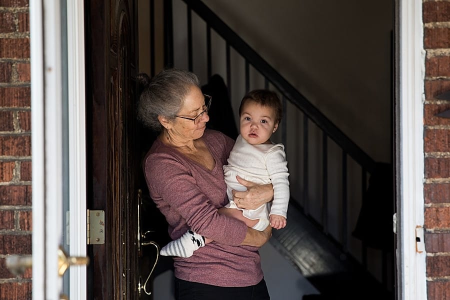 grandma and baby in doorway Preparing for a family photo session at your Pittsburgh home