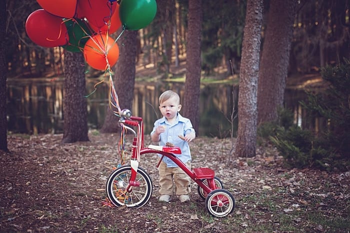 little boy with balloons on a tricycle at G. Sahli nature park inn Chippewa pa for a photo session locations for photo sessions in beaver county