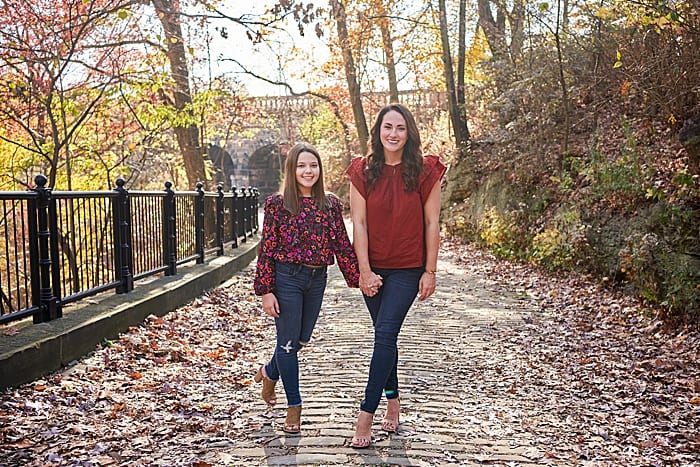 mother and daughter on cobblestone path behind Schenley visitor center in Schenley park 