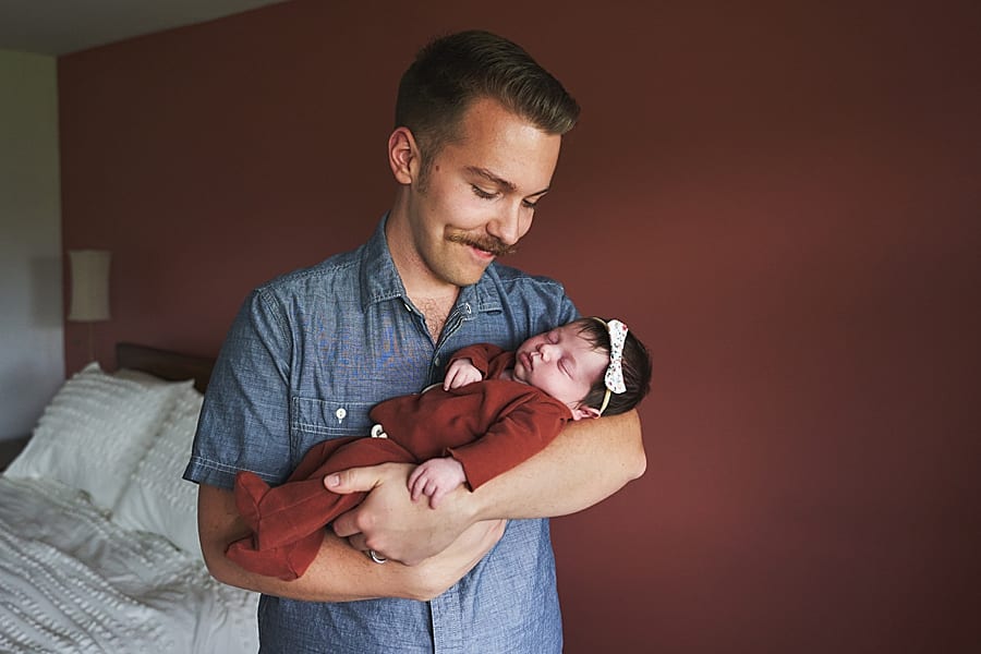 dad holding baby for in home newborn photo session pittsburgh with Mary Beth Miller photography 