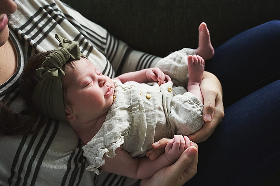 baby on couch with mom for in home newborn photo session with Mary Beth Miller photography 