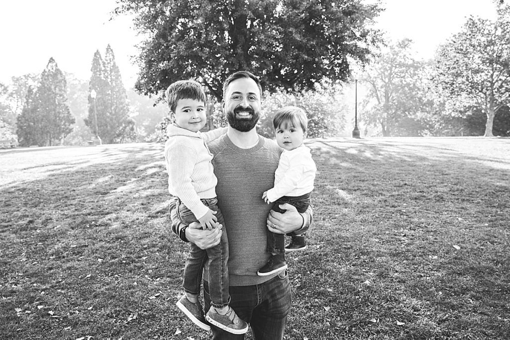 dad holding boys at Mellon Park walled garden for a family photo session