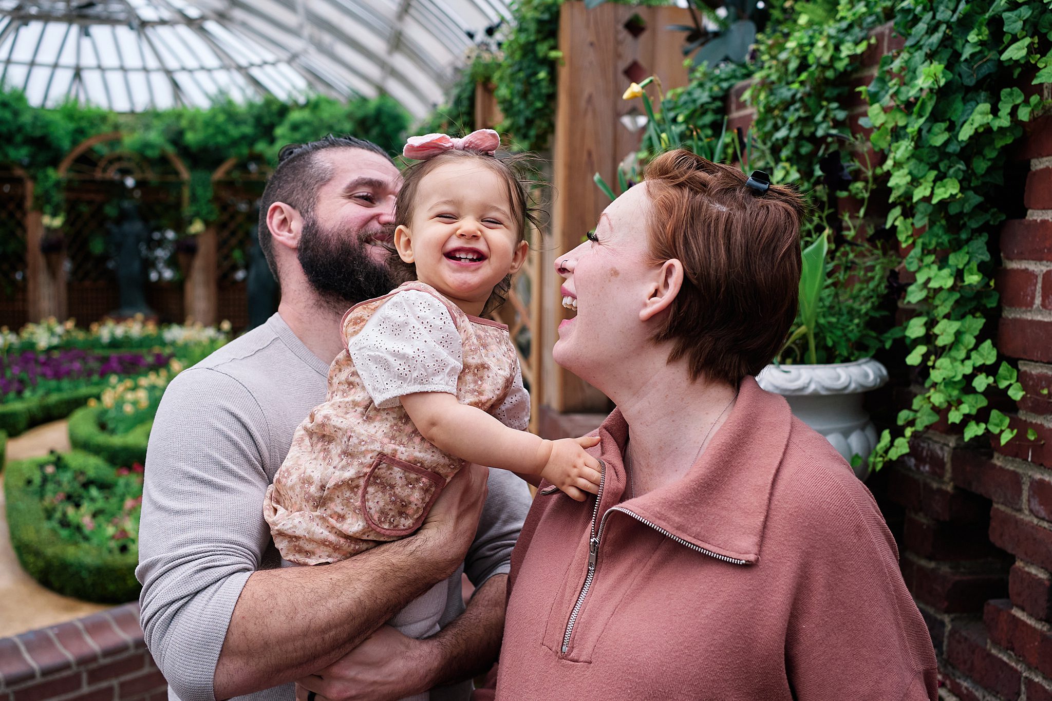baby and parents at Phipps conservatory in pittsburgh for family photo session 