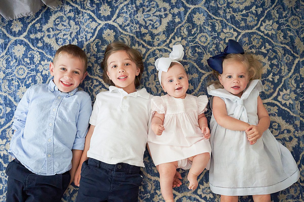 4 siblings laying on the floor for family session in upper saint clair
