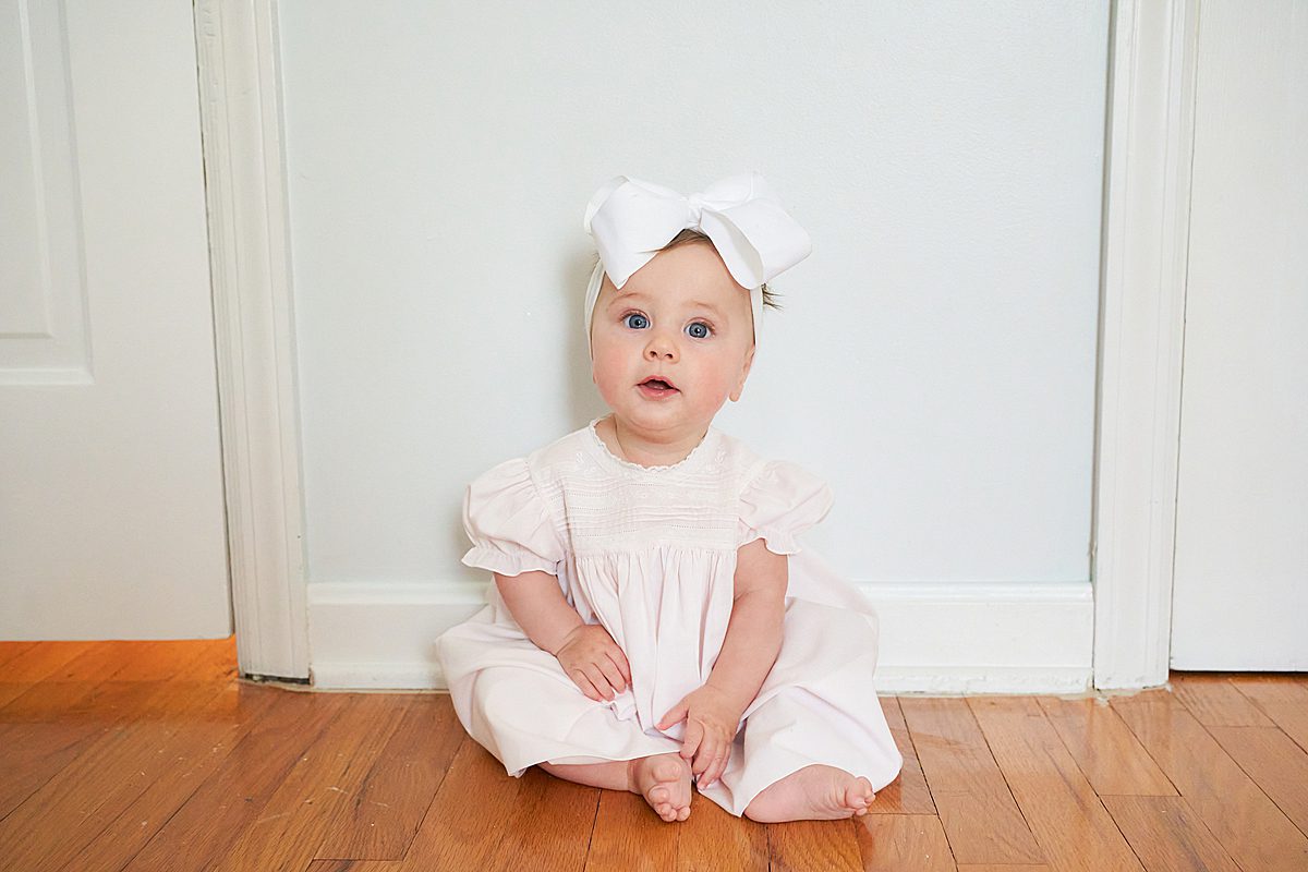 baby girl in nursery for family session in upper saint clair