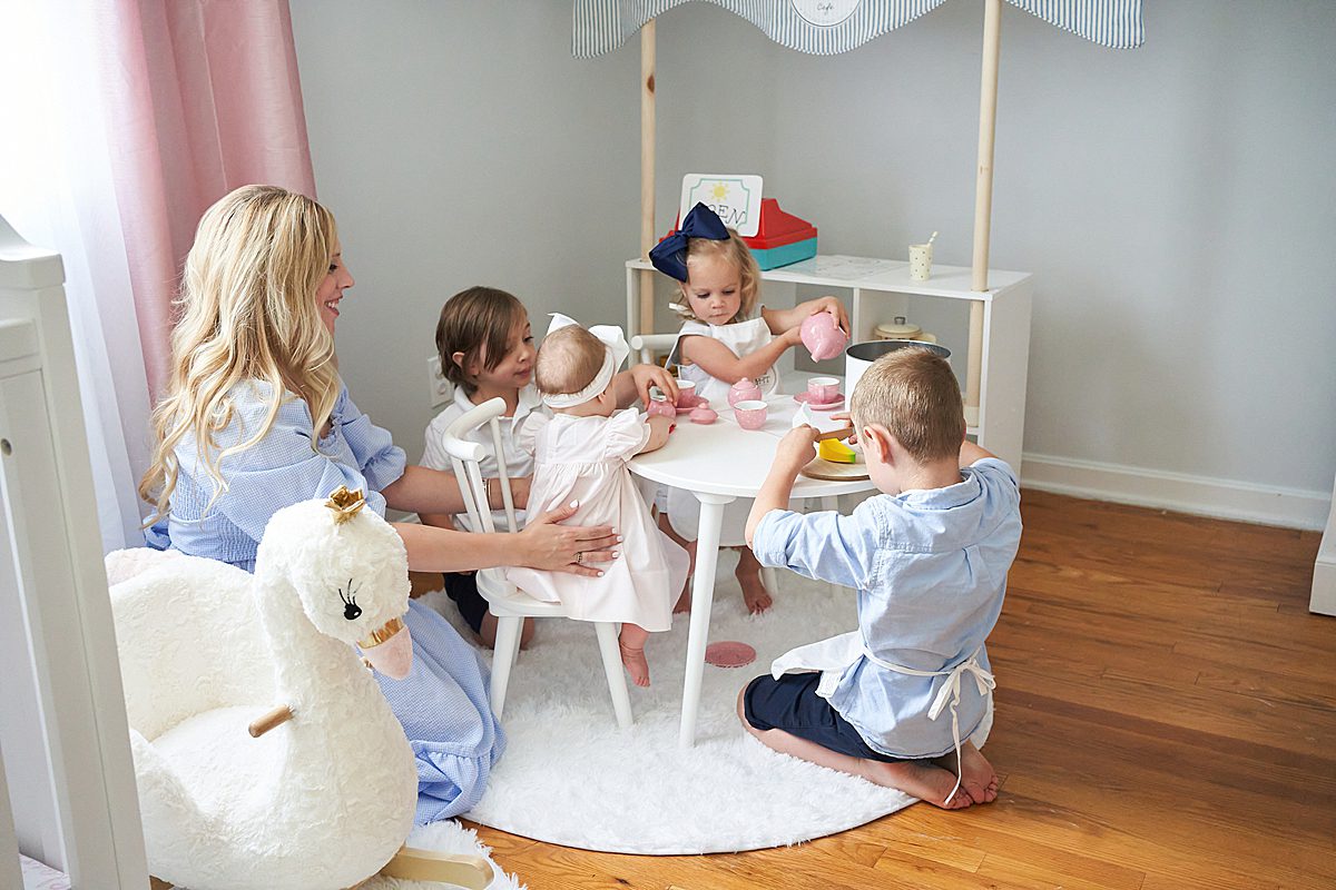 mom with children at table in Upper Saint Clair Home for a family photo session 