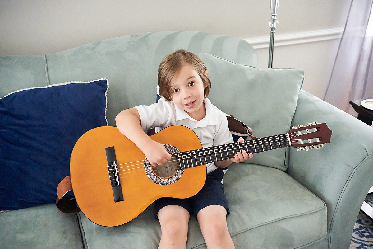upper saint clair family photo session in home with boy and guitar