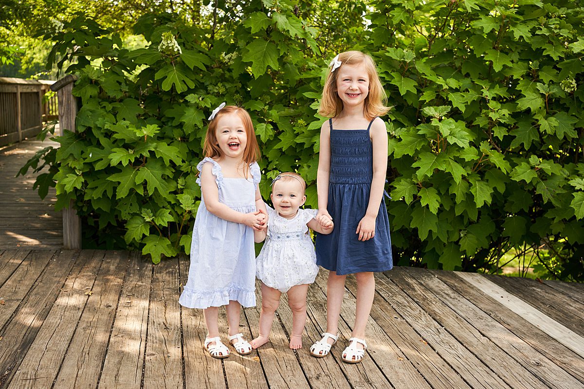 three sisters in fox chapel at beechwood farms nature park for a family photo session with Mary Beth Miller photography 