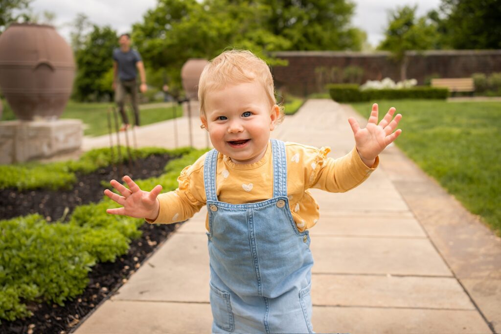 little girl running in Mellon park walled garden SHADYSIDE