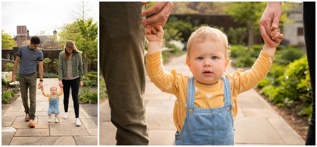 baby girl holding hands with her parents walking in Mellon park walled garden SHADYSIDE