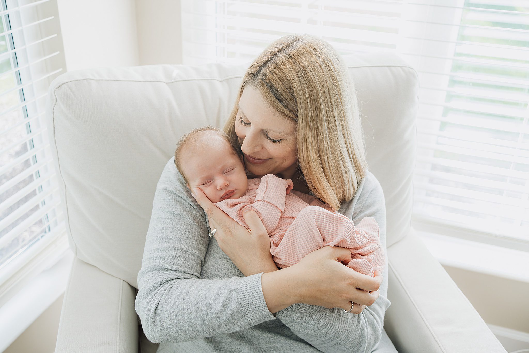 mom and newborn baby girl in their Neshannock township home for a lifestyle newborn photo session